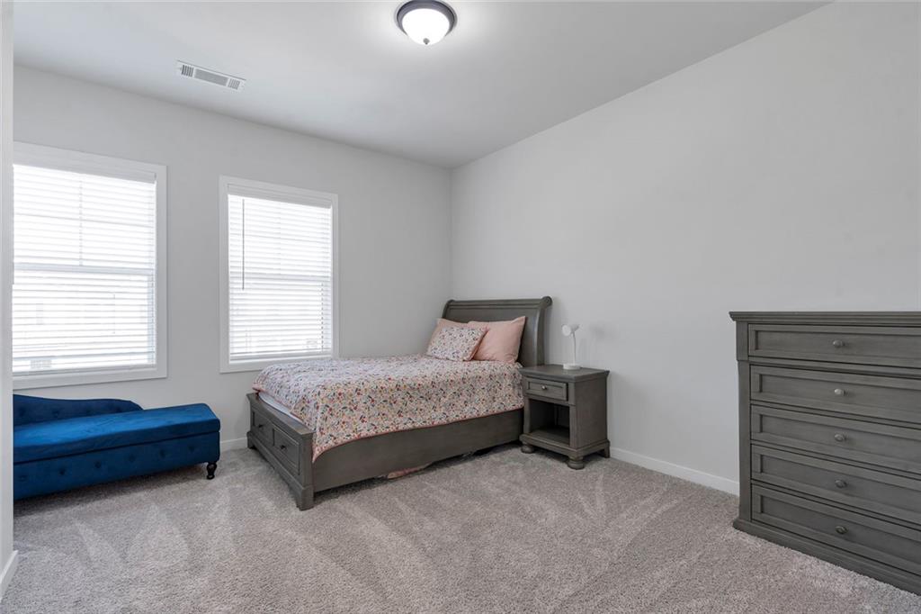 5316 Milford Road Gainesville, GA 30507 - Photo 31 of 44 a spacious bedroom with a bed and a window