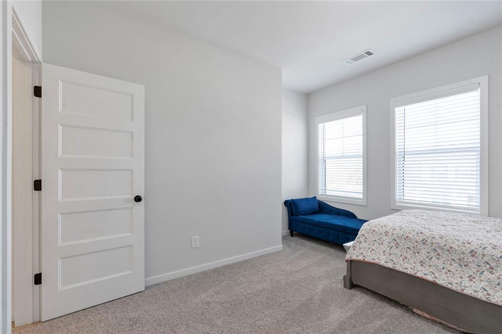 5316 Milford Road Gainesville, GA 30507 - Photo 32 of 44 a bedroom with a bed and a dresser