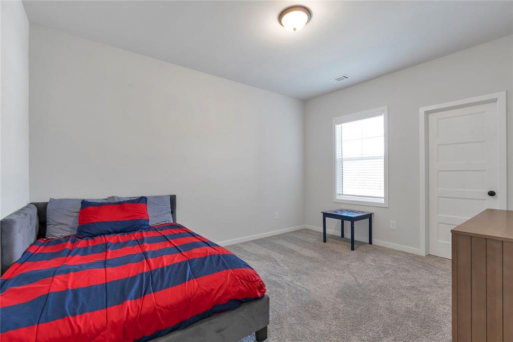 5316 Milford Road Gainesville, GA 30507 - Photo 33 of 44 a bedroom with a bed and a window