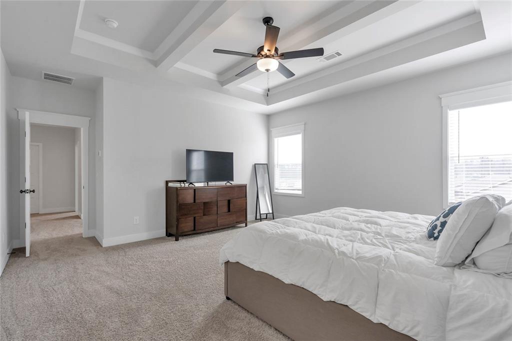 5316 Milford Road Gainesville, GA 30507 - Photo 38 of 44 a bedroom with a bed and ceiling fan