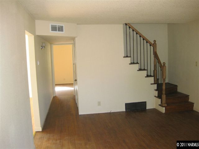 1185 Monitor Drive Reno, NV 89512 - Photo 4 of 13 a view of a hallway with wooden floor and entryway