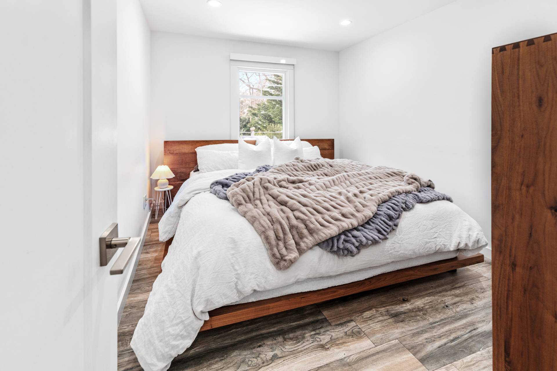 778 Bridgehampton Sag Harbor Bridgehampton, NY 11932 - Photo 14 of 18 a large bed sitting in a bedroom next to a window