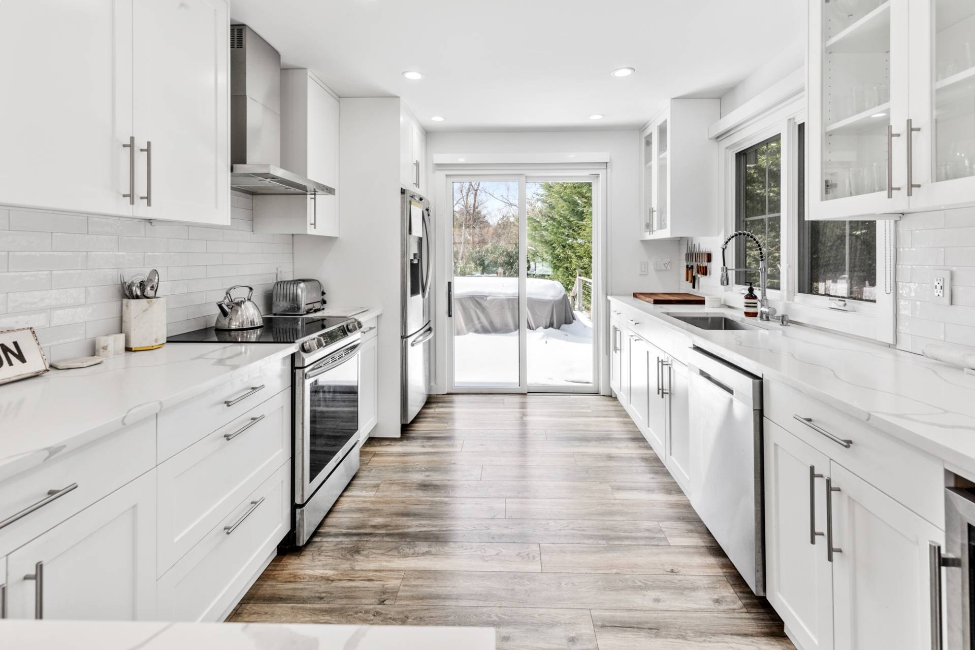 778 Bridgehampton Sag Harbor Bridgehampton, NY 11932 - Photo 5 of 18 a kitchen with stainless steel appliances a sink stove and cabinets