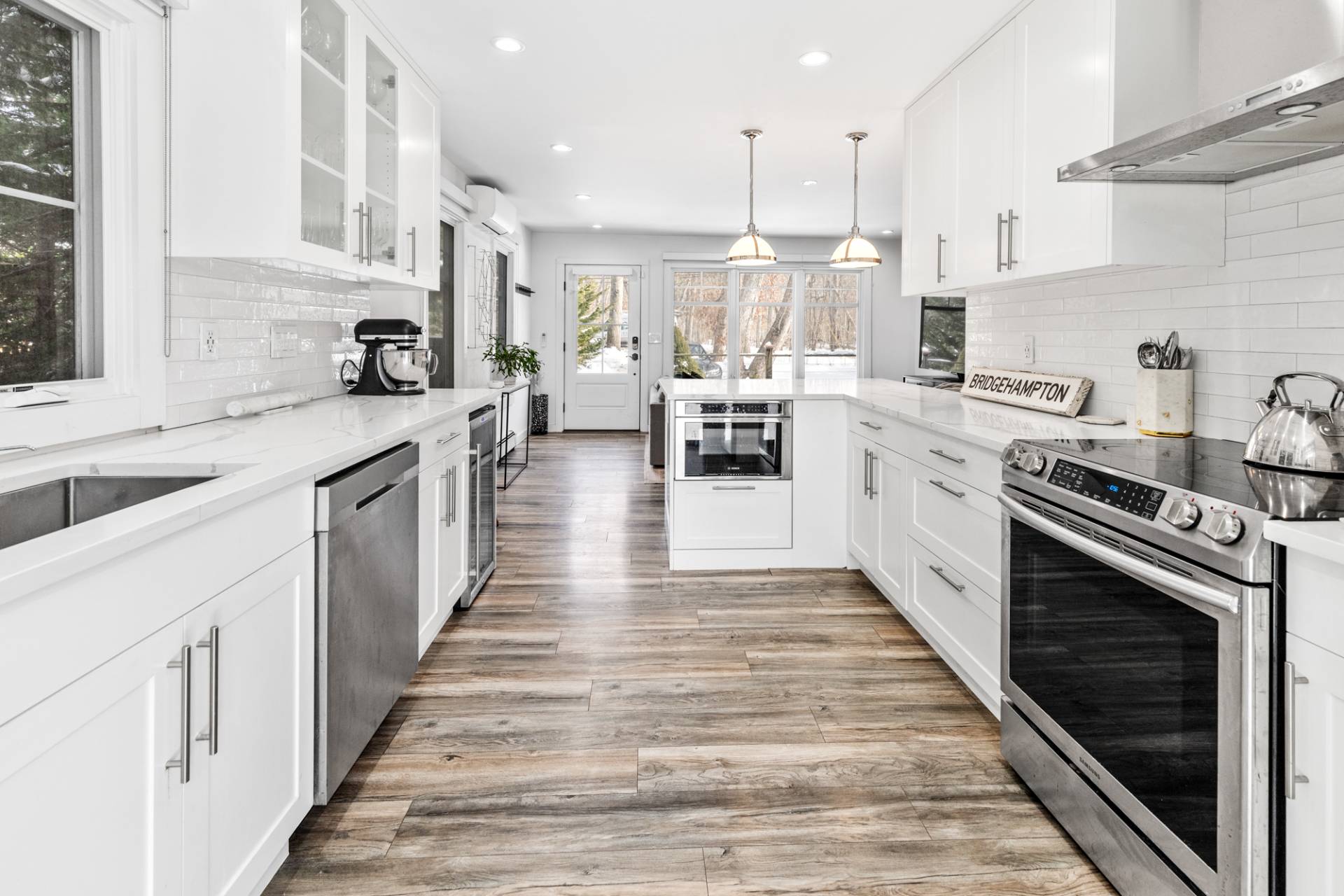 778 Bridgehampton Sag Harbor Bridgehampton, NY 11932 - Photo 6 of 18 a large white kitchen with lots of appliances
