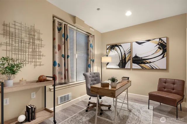 a view of a workspace with furniture