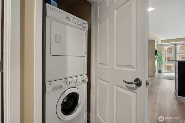 a view of a hallway with washer and dryer