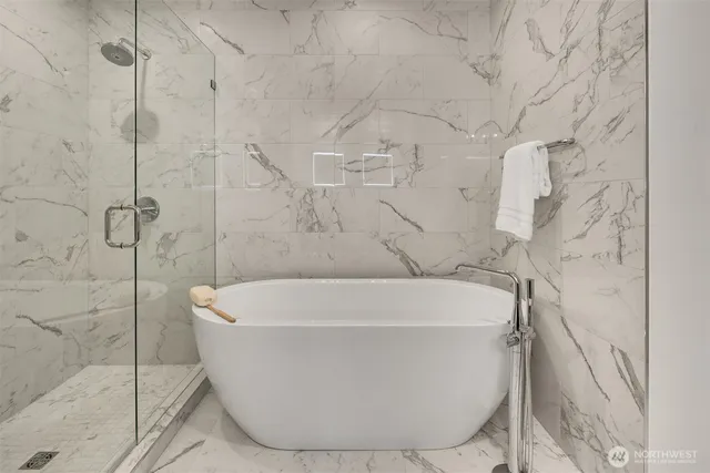a white bath tub sitting in a bathroom