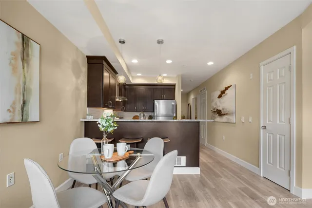 a dining room with furniture and window
