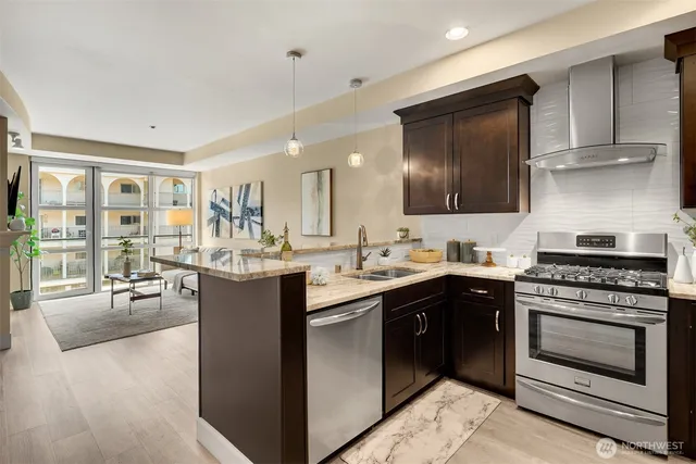 a kitchen with a stove top oven sink and cabinets