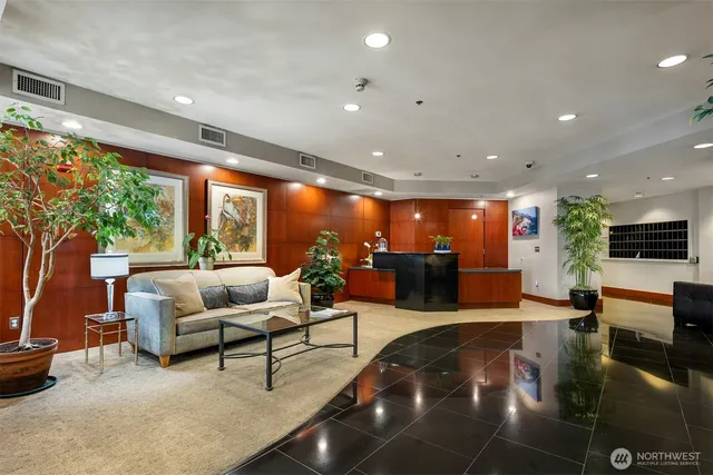 a living room with furniture and a large window