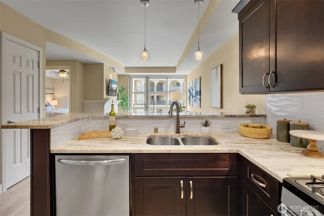 a kitchen with a sink stove and cabinets
