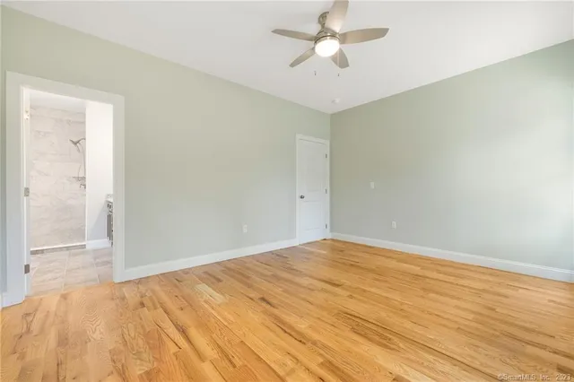 an empty room with a empty space and a window