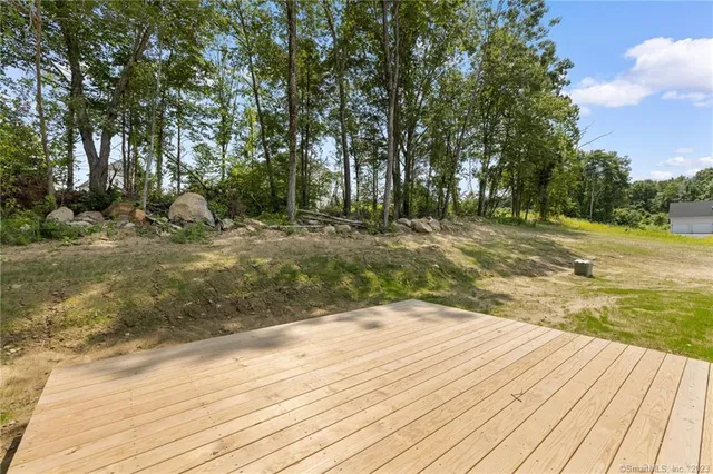 a view of empty room with wooden ceiling