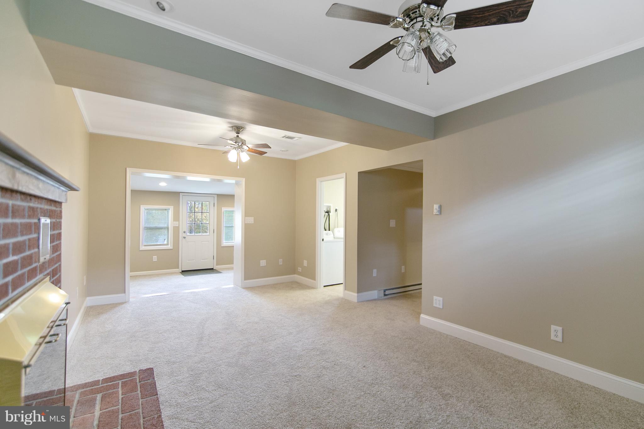8306 Hollow Road Middletown, MD 21769 - Photo 11 of 37 a view of a hallway with a chandelier