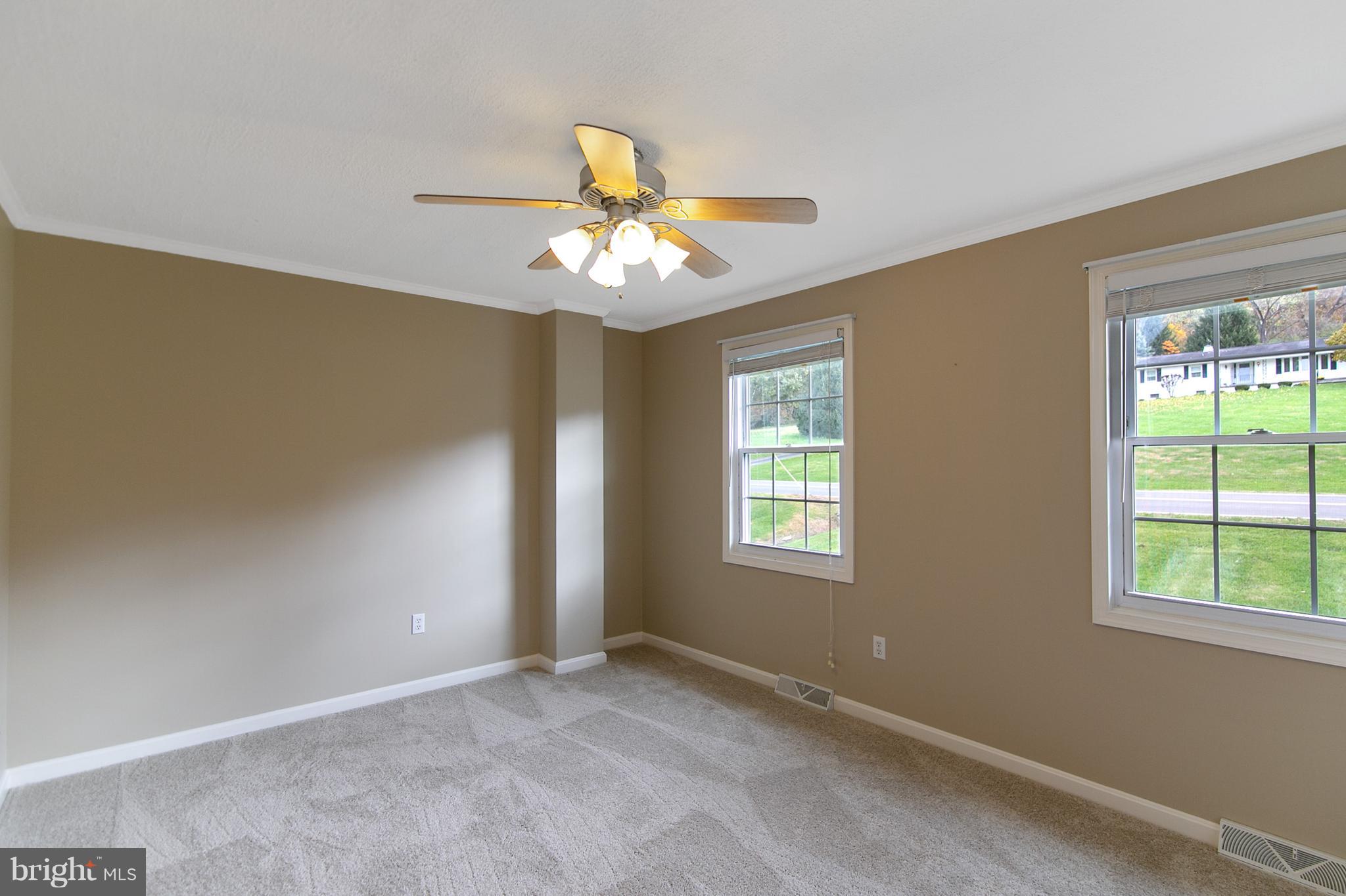 8306 Hollow Road Middletown, MD 21769 - Photo 15 of 37 a view of an empty room with a window