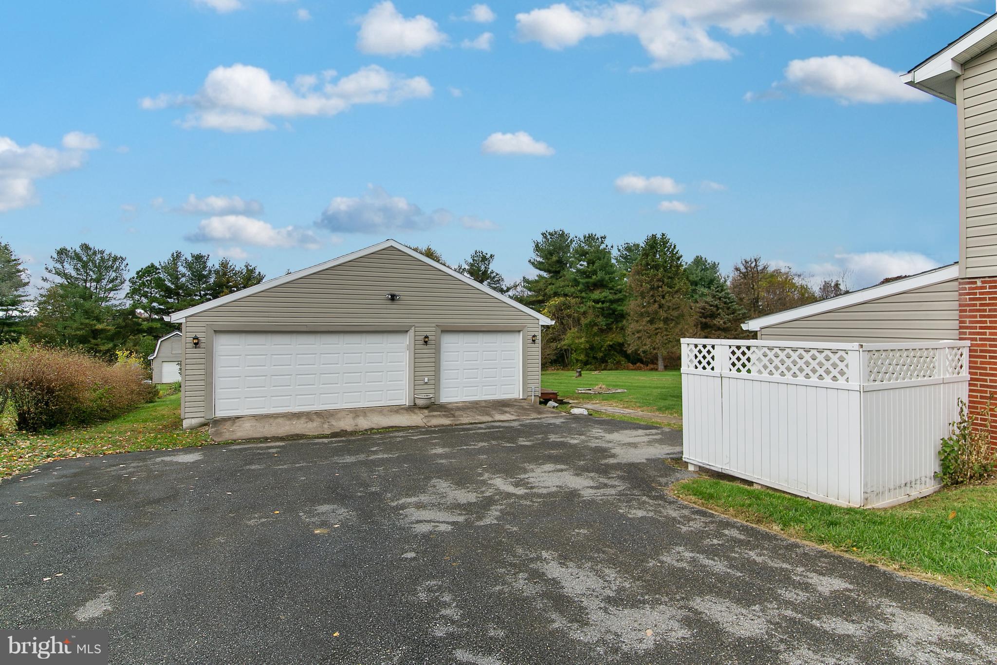 8306 Hollow Road Middletown, MD 21769 - Photo 25 of 37 a view of a house with a yard and garage