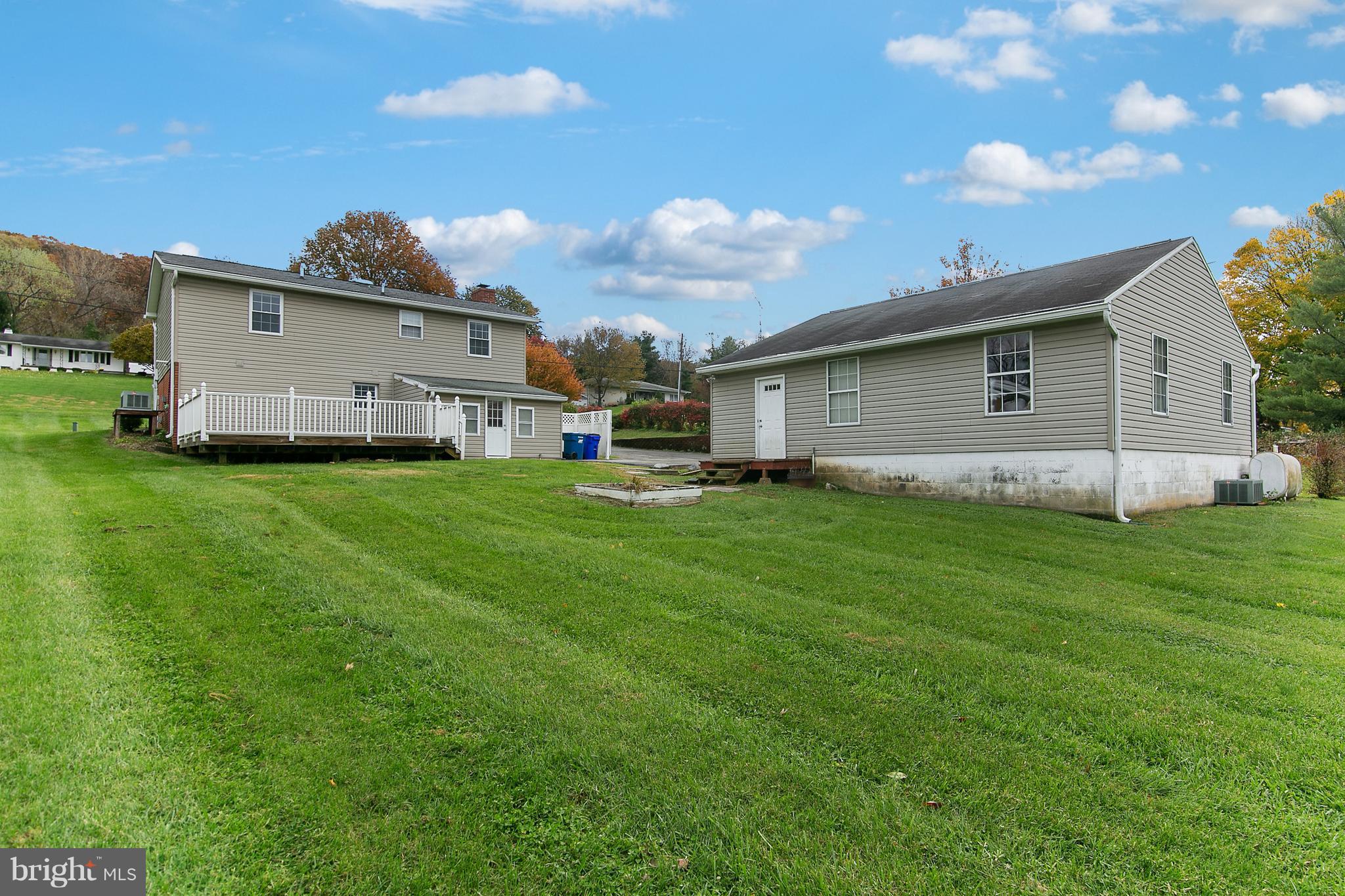 8306 Hollow Road Middletown, MD 21769 - Photo 27 of 37 a backyard of a house with table and chairs
