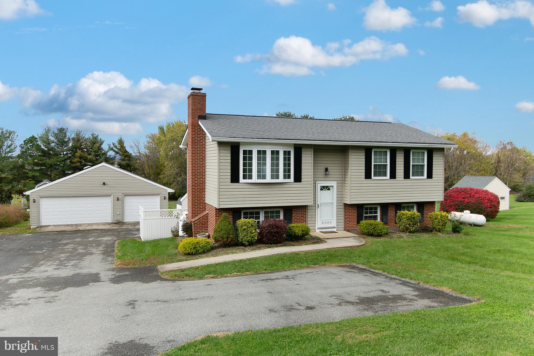 8306 Hollow Road Middletown, MD 21769 - Photo 33 of 37 a front view of a house with garden