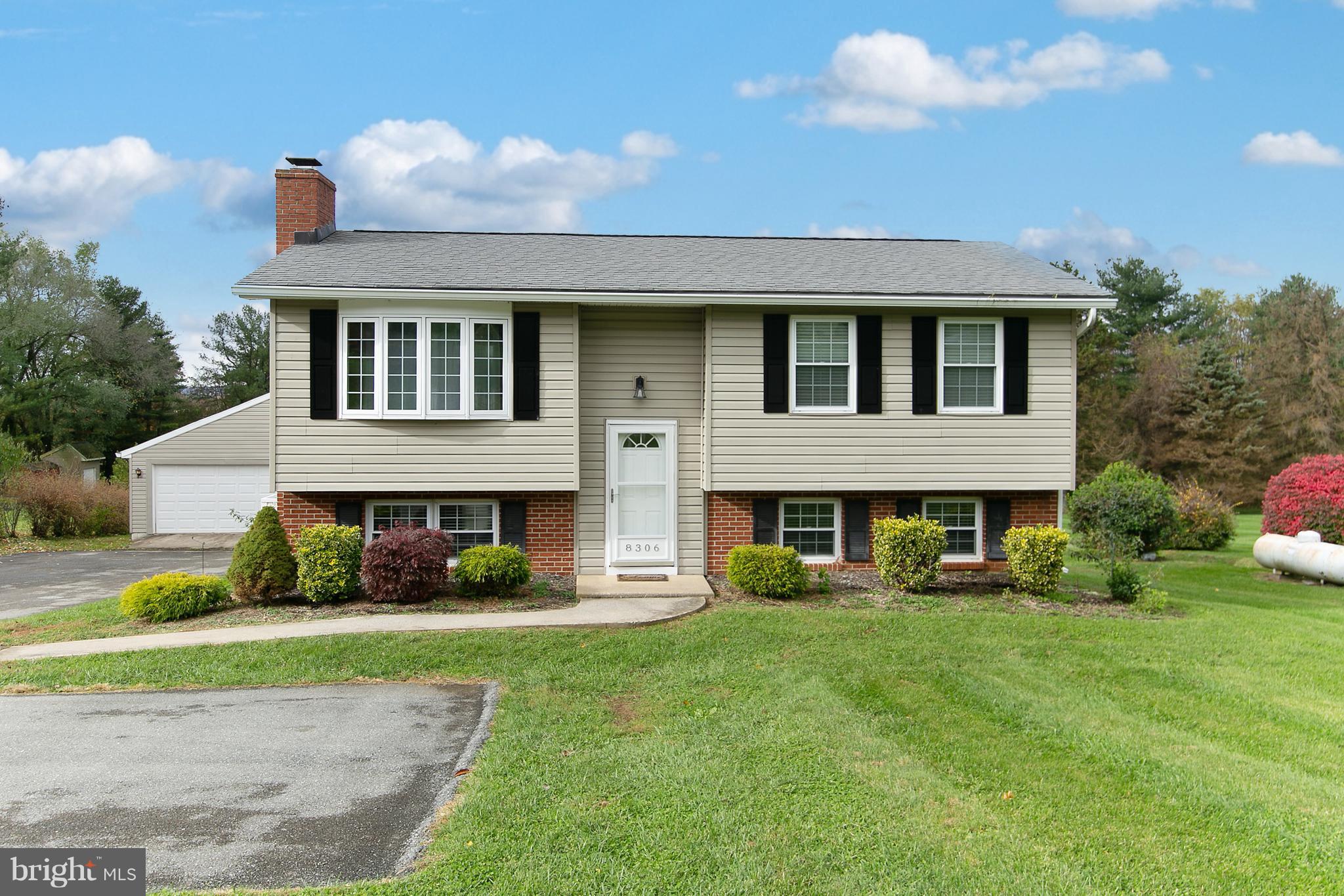 8306 Hollow Road Middletown, MD 21769 - Photo 34 of 37 a front view of a house with garden