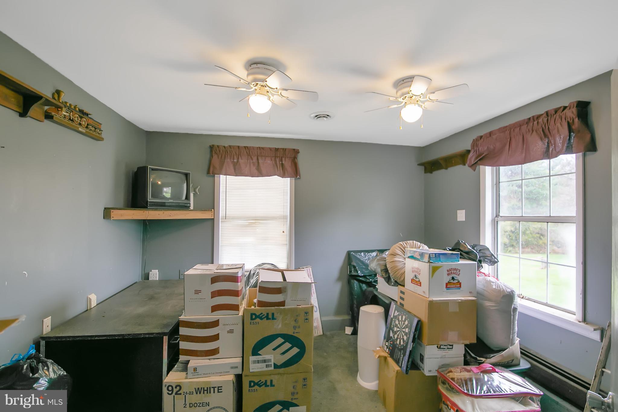 8306 Hollow Road Middletown, MD 21769 - Photo 35 of 37 a bedroom with furniture and a window