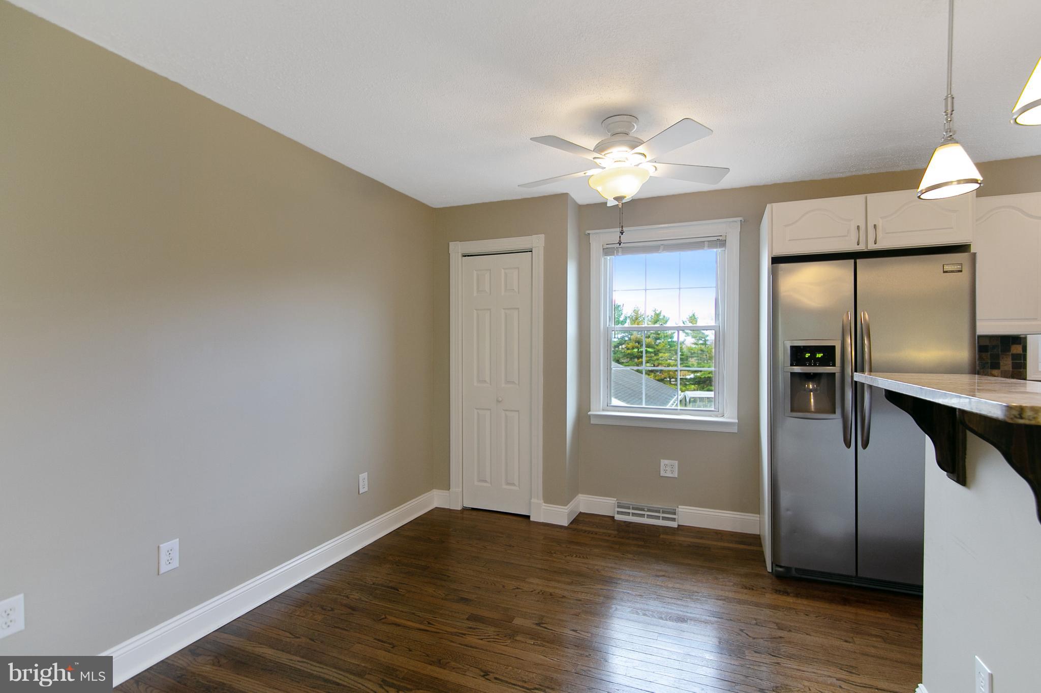 8306 Hollow Road Middletown, MD 21769 - Photo 7 of 37 a view of a kitchen with a dishwasher cabinets and wooden floor