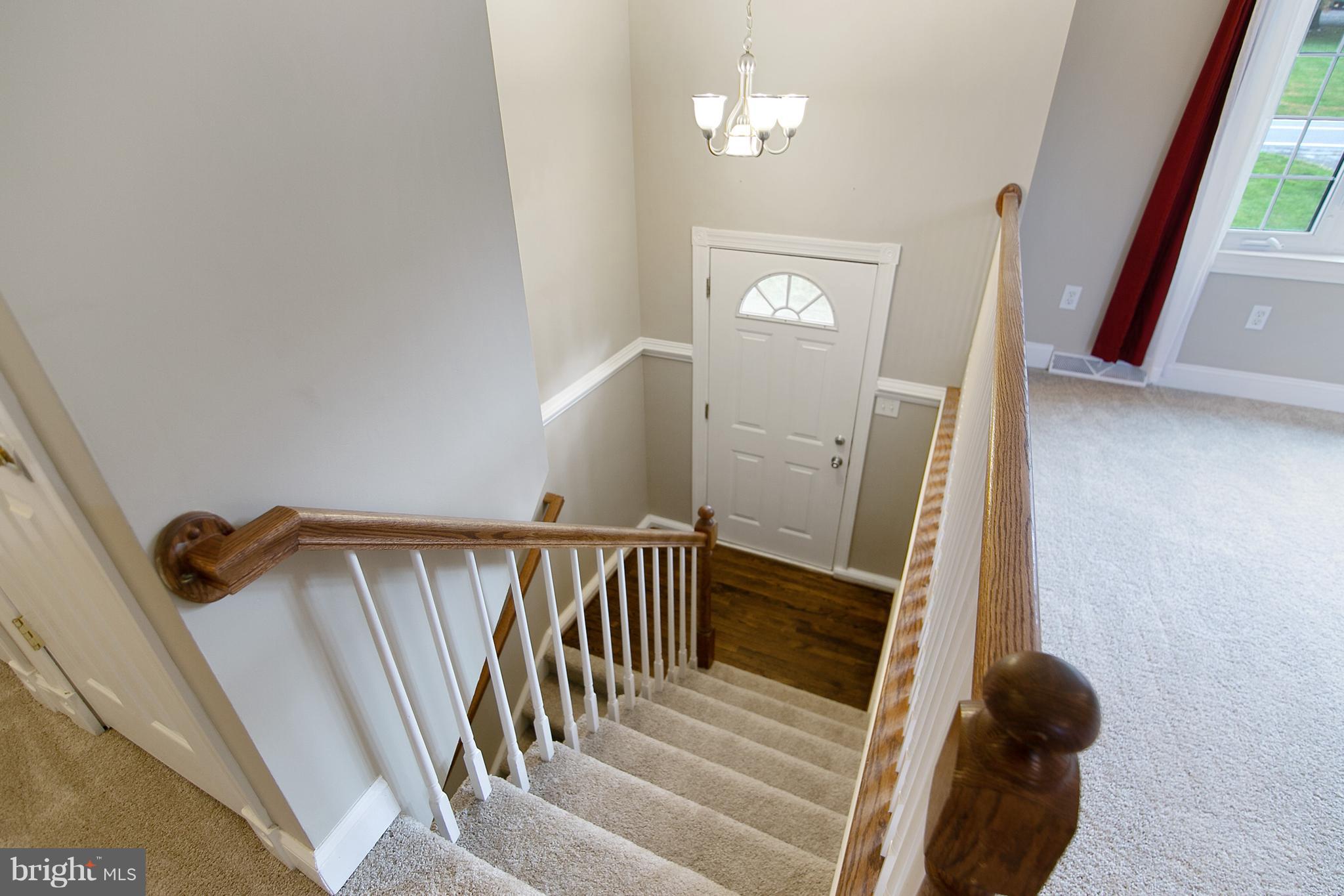 8306 Hollow Road Middletown, MD 21769 - Photo 10 of 37 a view of entryway and hall with wooden floor