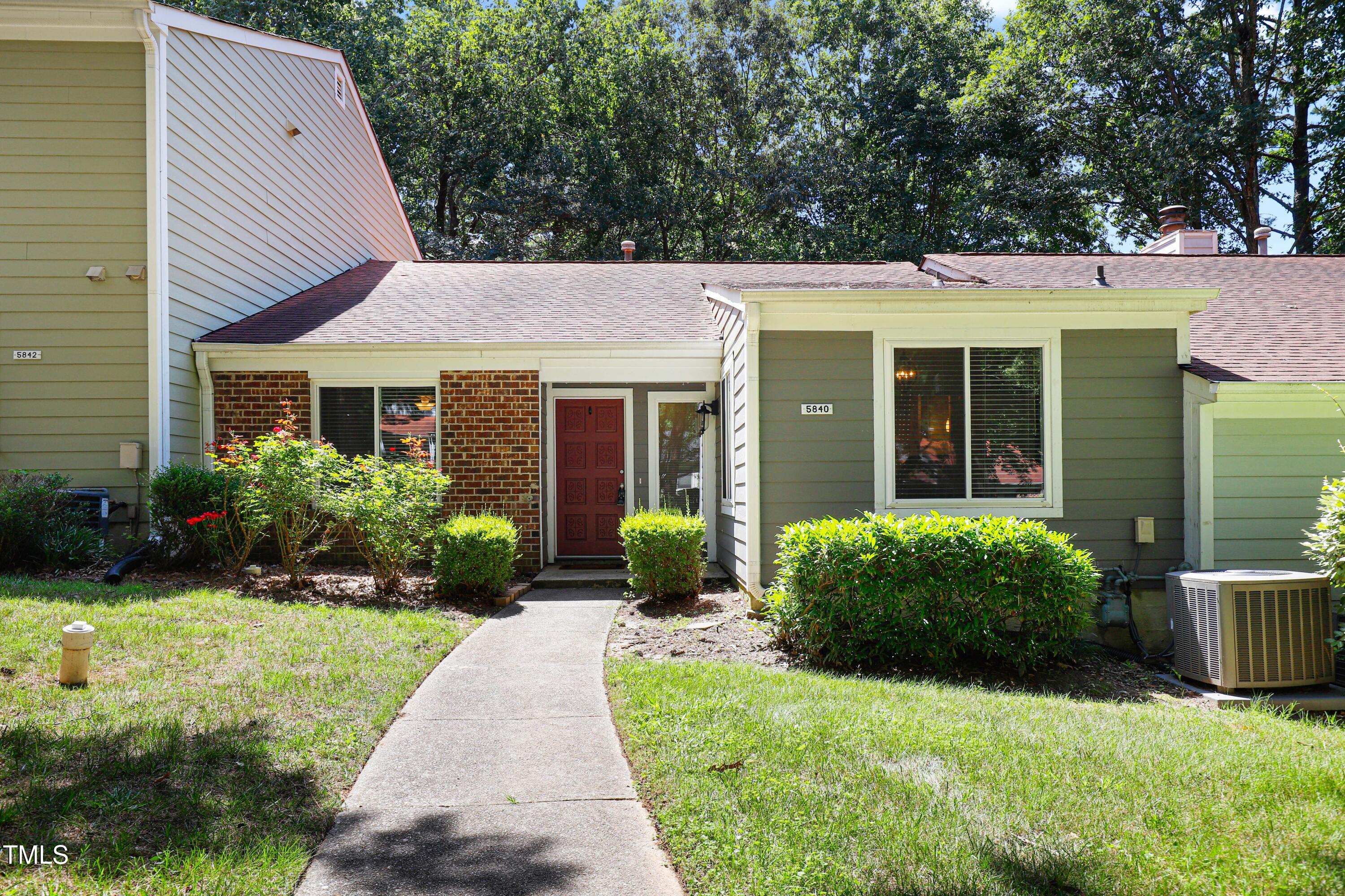 a view of a house with garden and yard