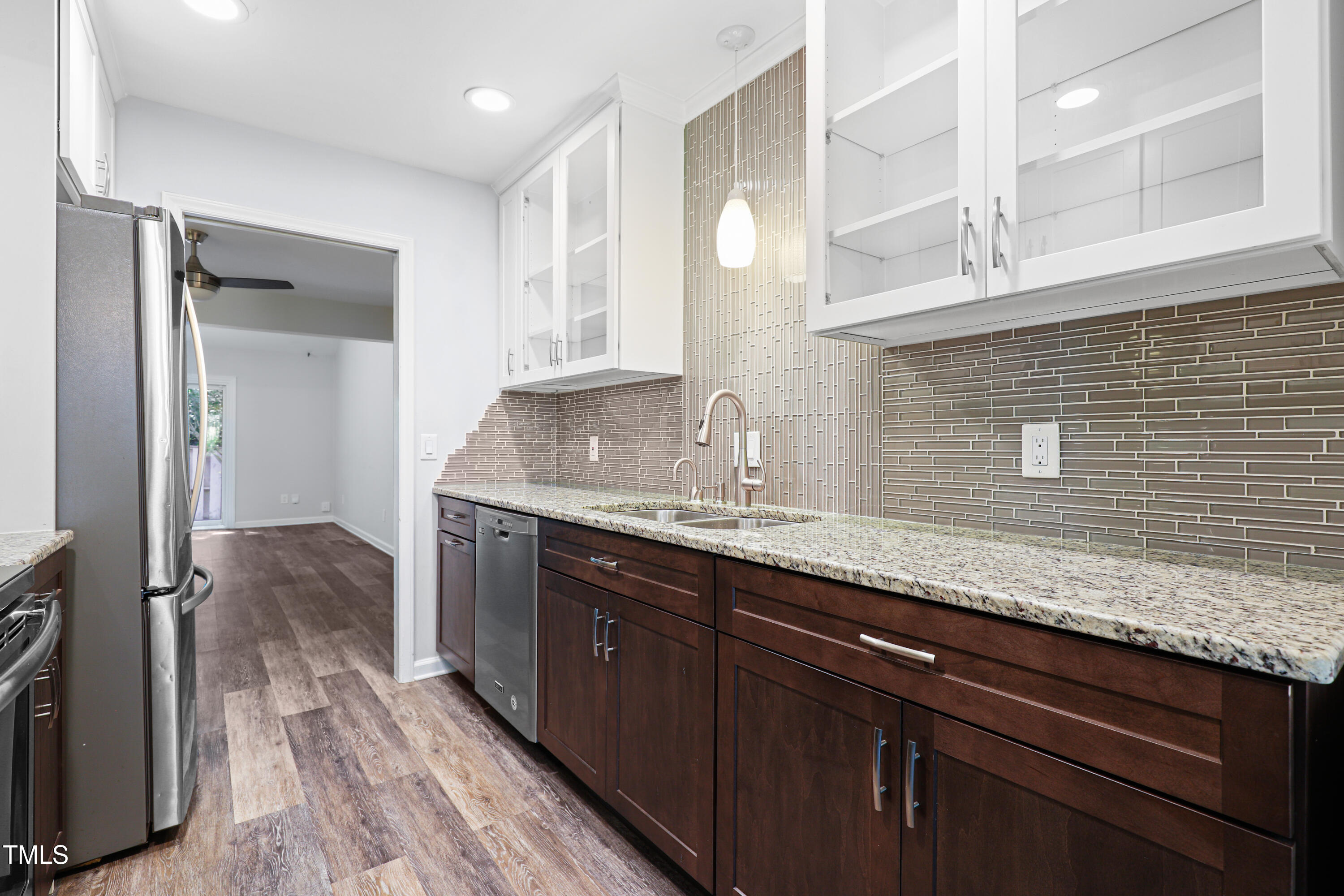 5840 Branchwood Road Raleigh, NC 27609 - Photo 12 of 33 a kitchen with granite countertop a sink and cabinets