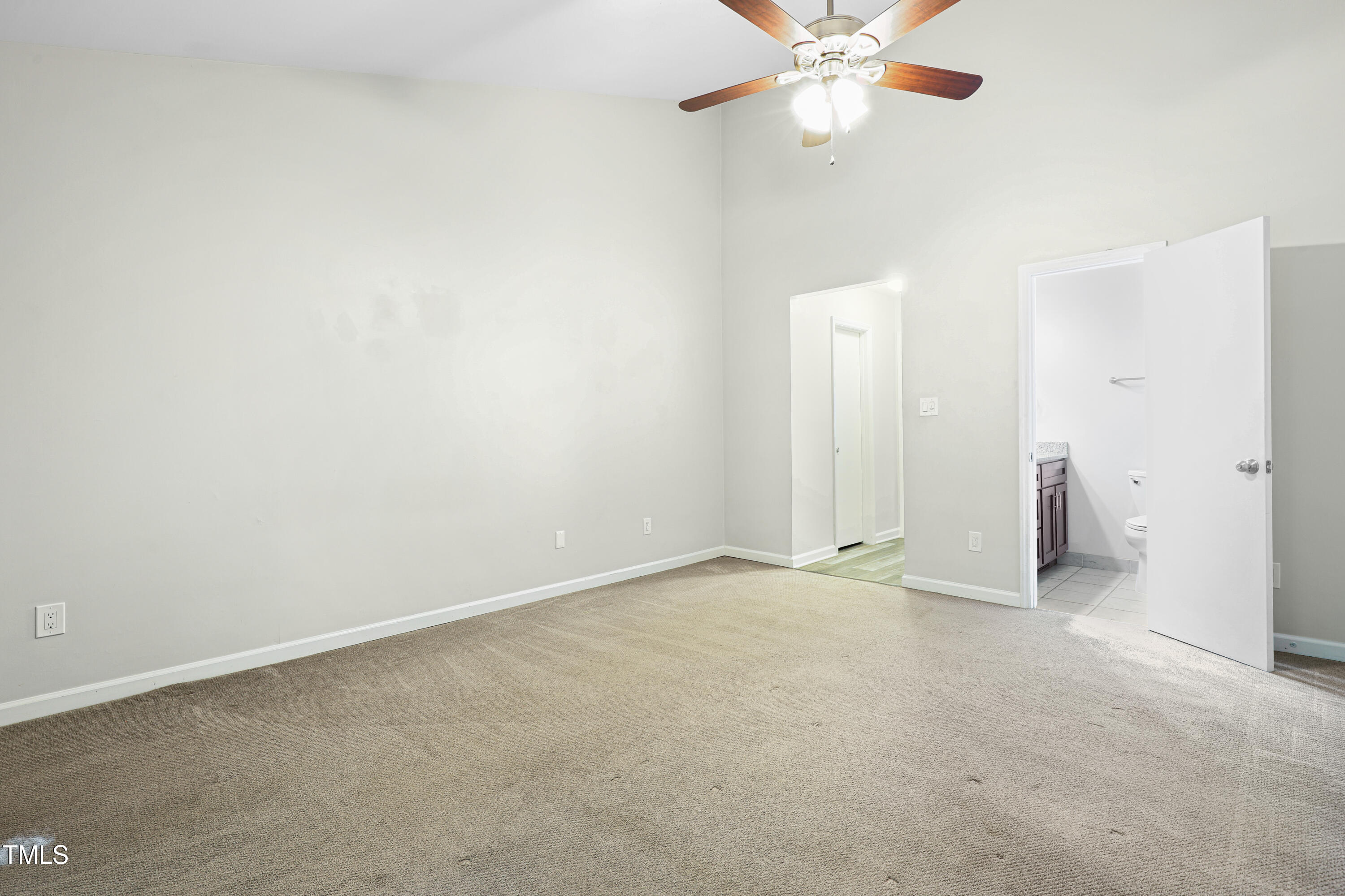 5840 Branchwood Road Raleigh, NC 27609 - Photo 15 of 33 an empty room with a fan and a window