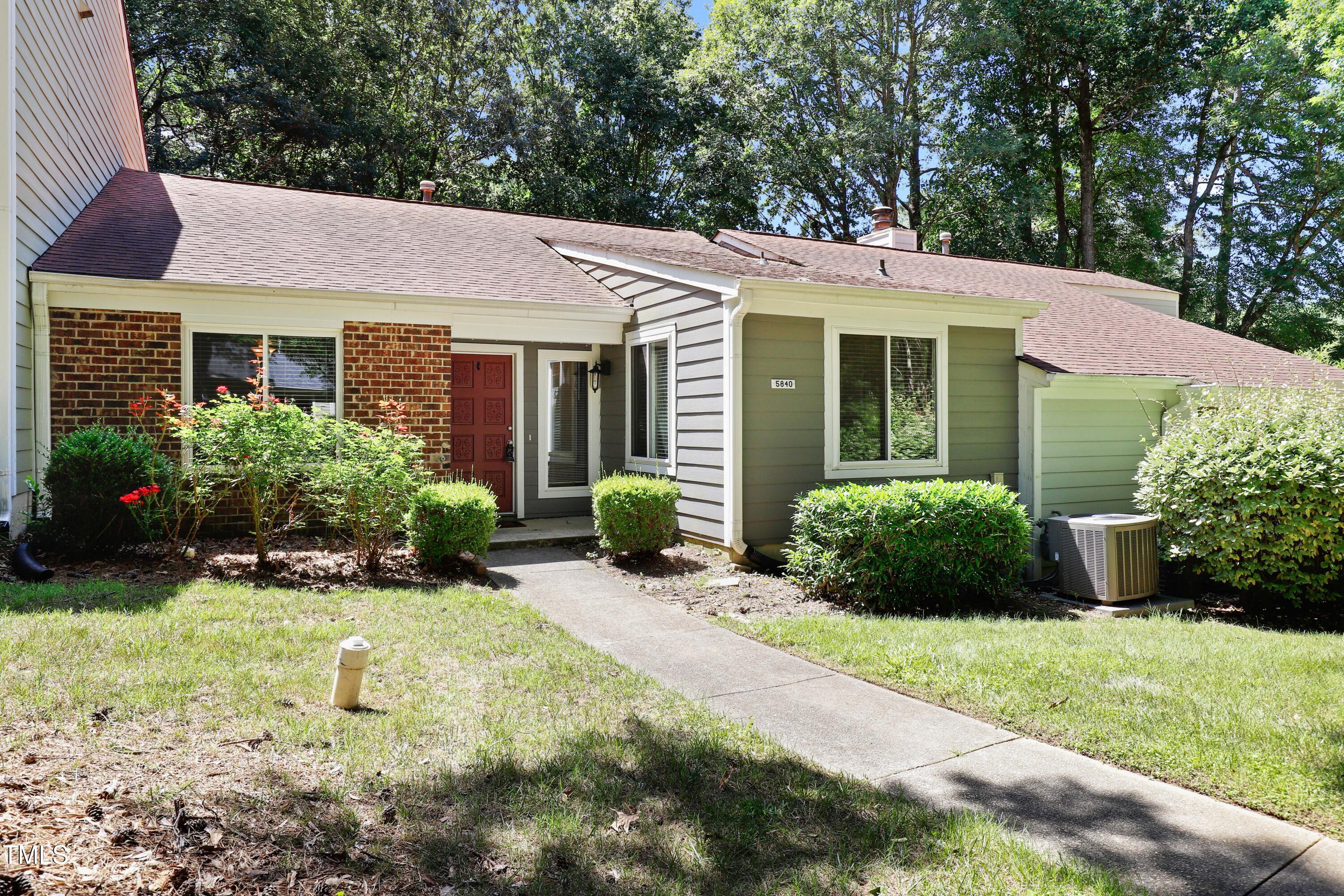 5840 Branchwood Road Raleigh, NC 27609 - Photo 2 of 33 a view of a house with garden and plants