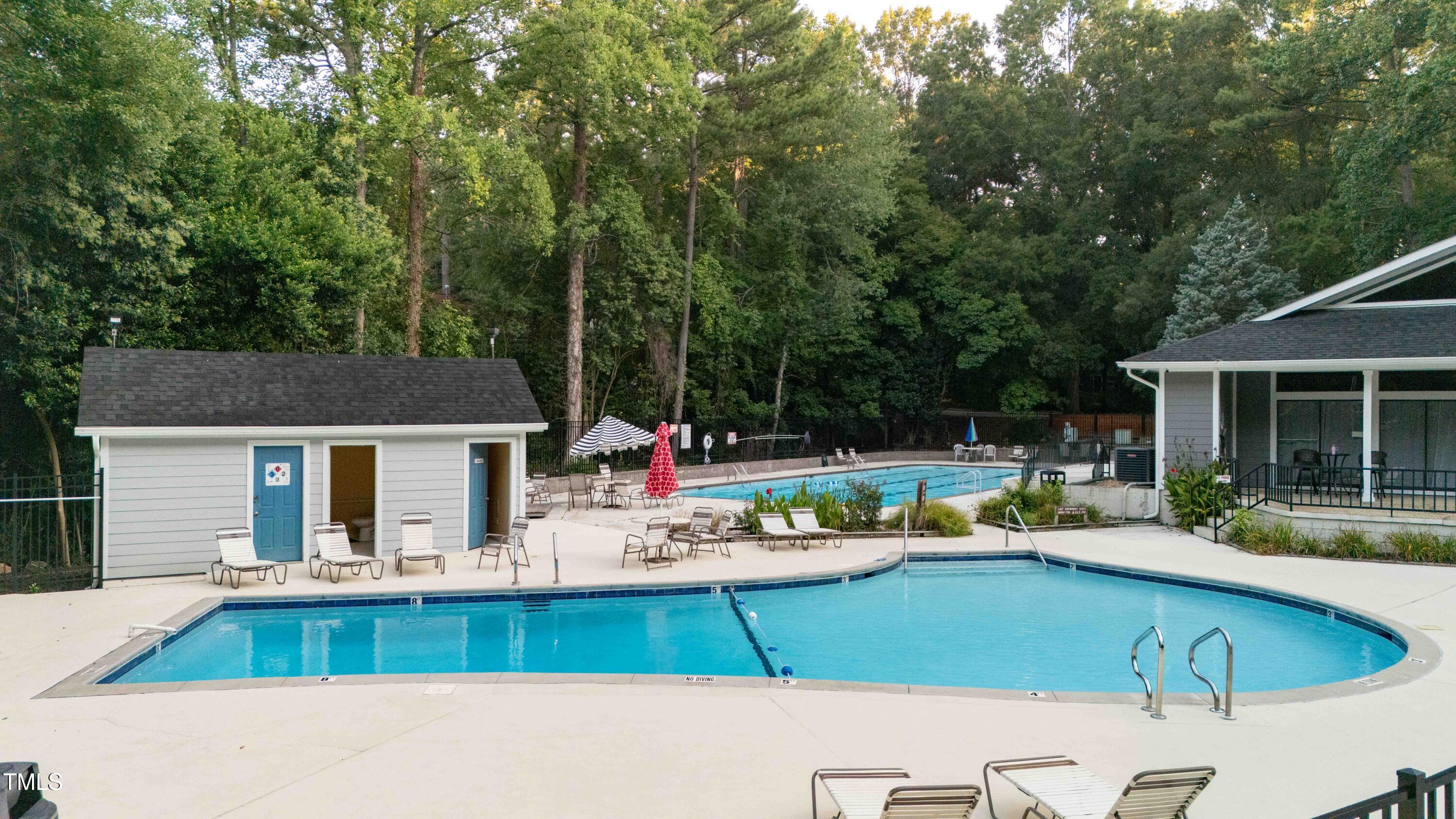 5840 Branchwood Road Raleigh, NC 27609 - Photo 30 of 33 a view of a house with pool and chairs