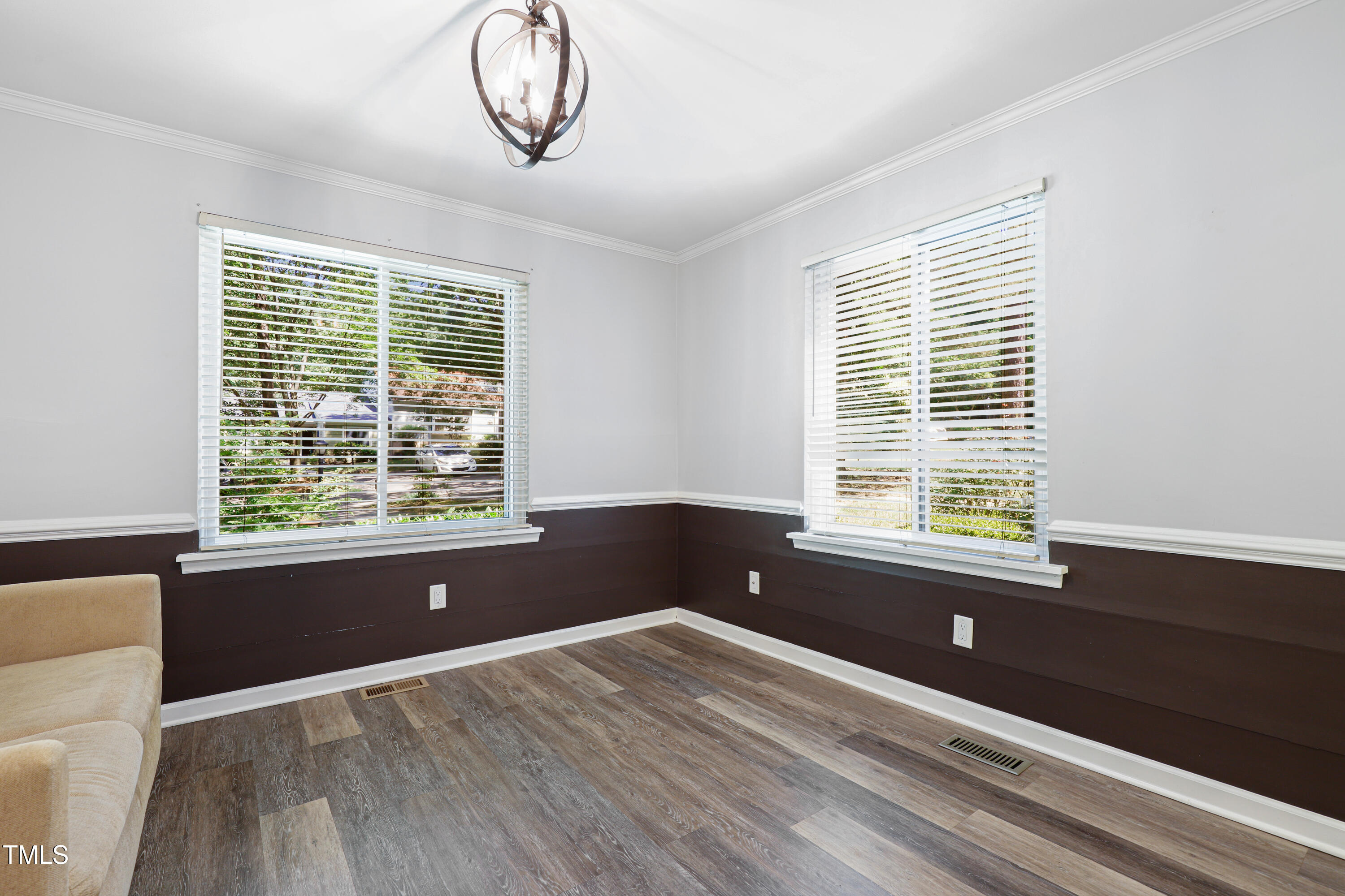5840 Branchwood Road Raleigh, NC 27609 - Photo 5 of 33 a view of wooden floor and windows in a room