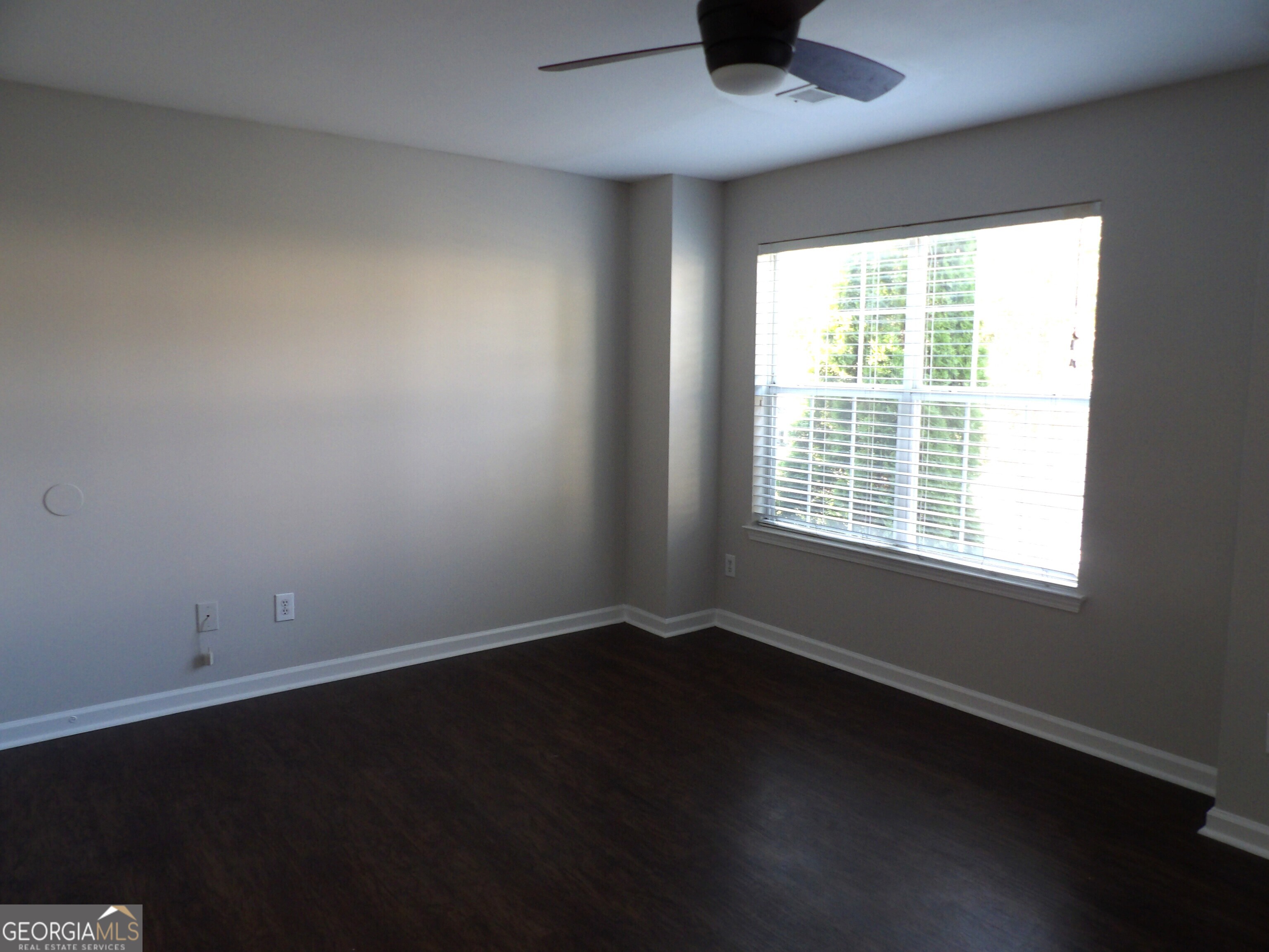 3503 Parc Circle Southwest Atlanta, GA 30311 - Photo 11 of 17 a view of an empty room with wooden floor and a window