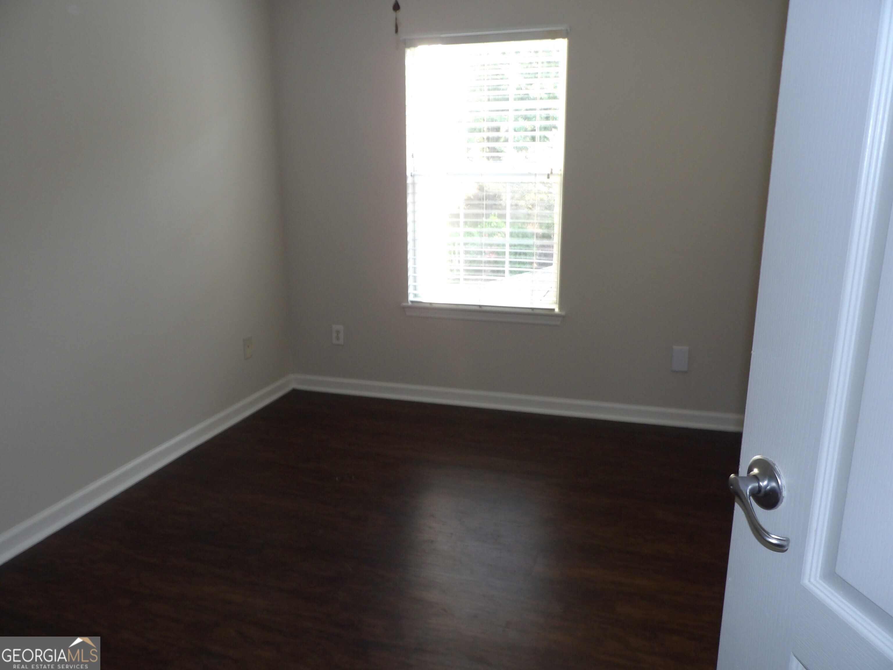 3503 Parc Circle Southwest Atlanta, GA 30311 - Photo 12 of 17 an empty room with wooden floor and windows