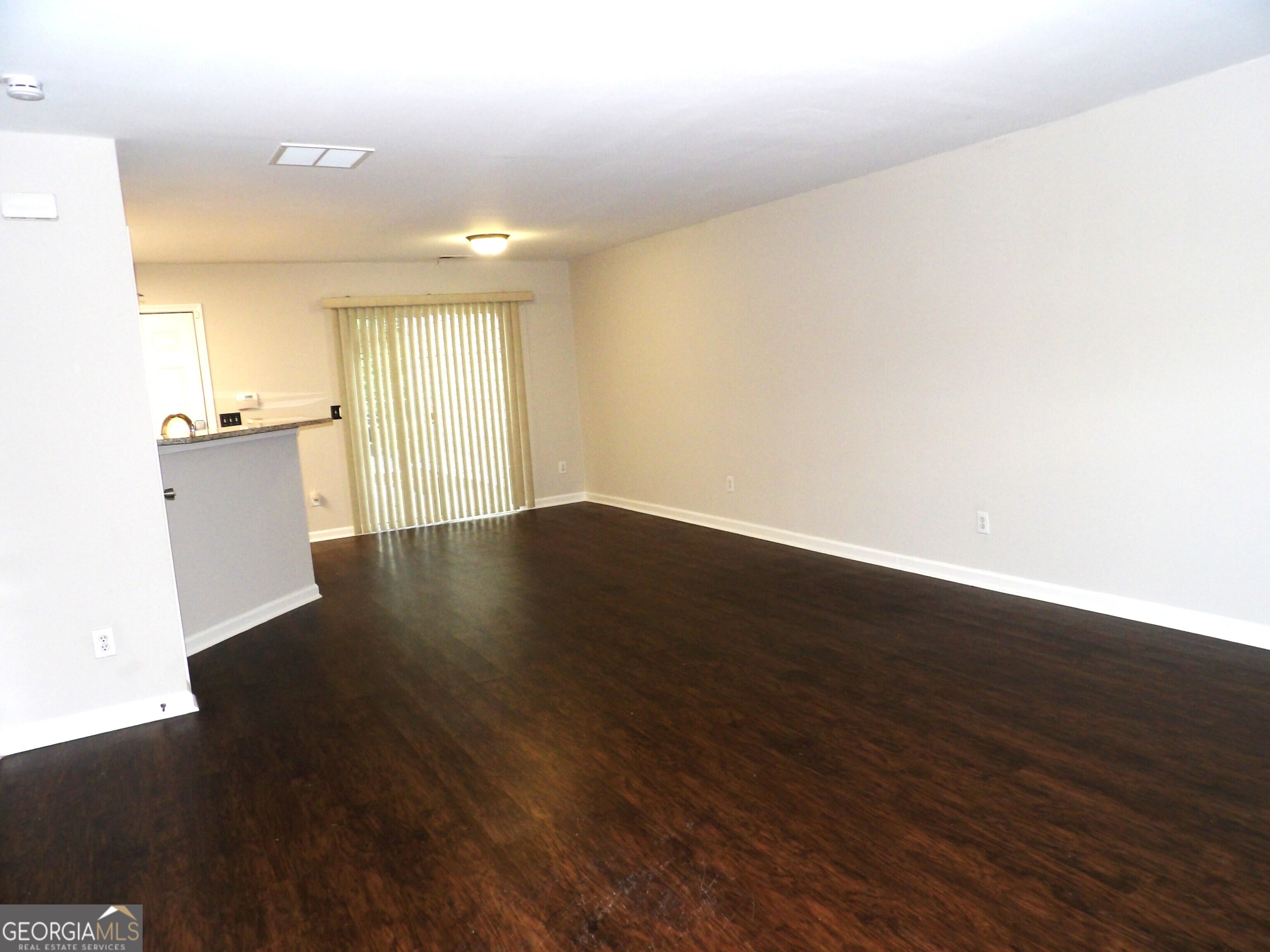 3503 Parc Circle Southwest Atlanta, GA 30311 - Photo 5 of 17 a view of an empty room with wooden floor and a window