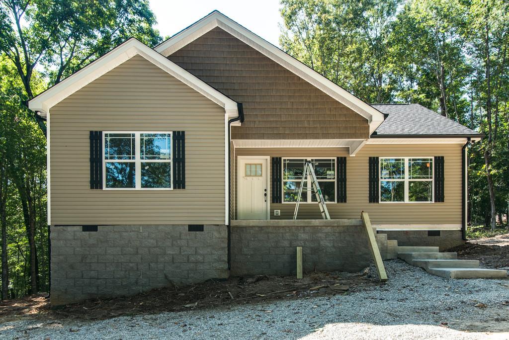 234 East Piney Road Dickson, TN 37055 - Photo 1 of 18 a front view of a house with garden