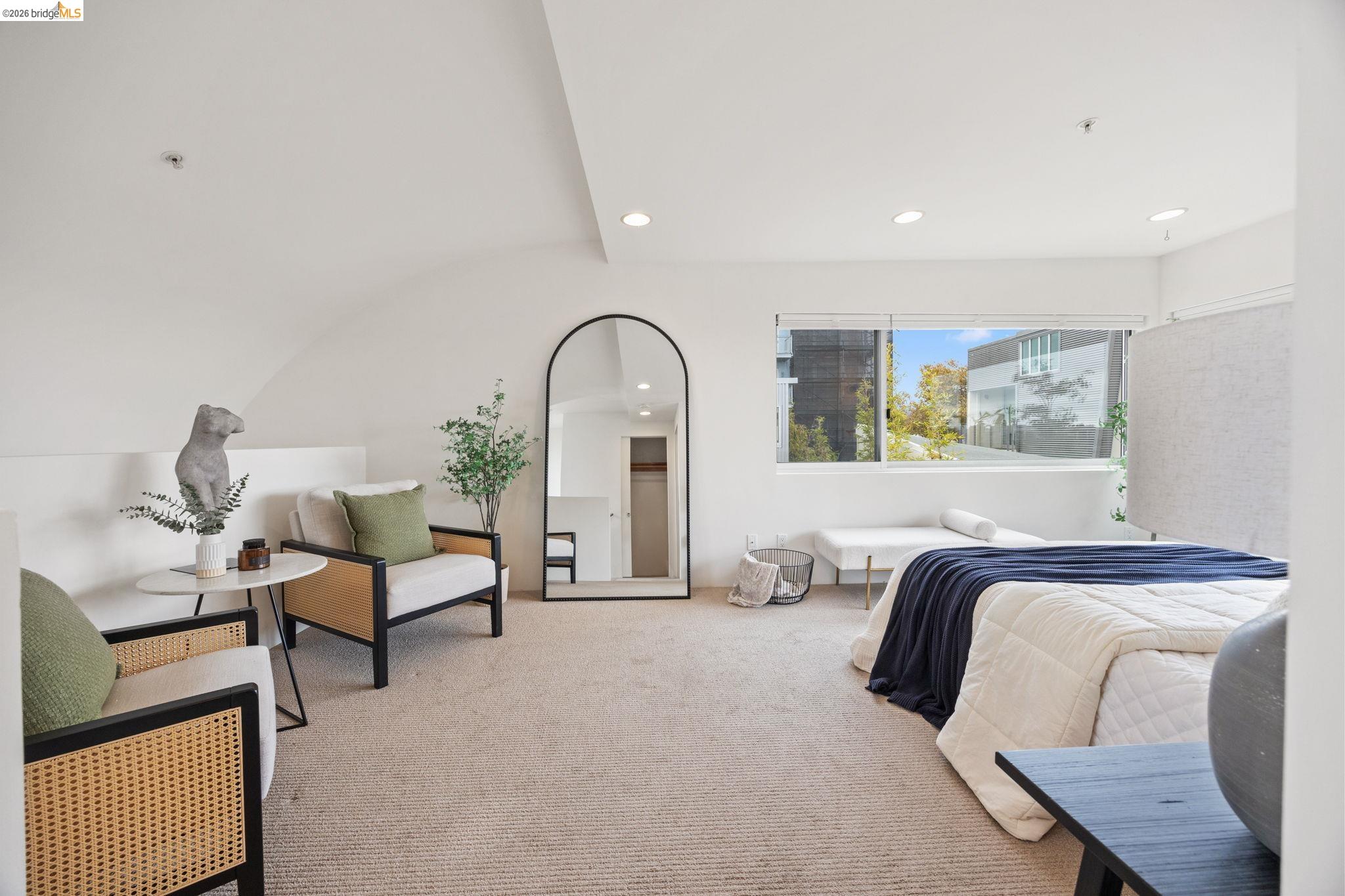 2709 Tenth Street, Unit D Berkeley, CA 94710 - Photo 19 of 29 Recessed lighting, carpeted flooring, window with natural light, arched ceiling, and a built-in privacy wall