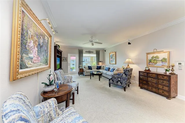 a bedroom with a bed a large window and book shelf