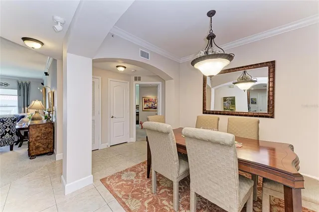 a living room with furniture and a piano