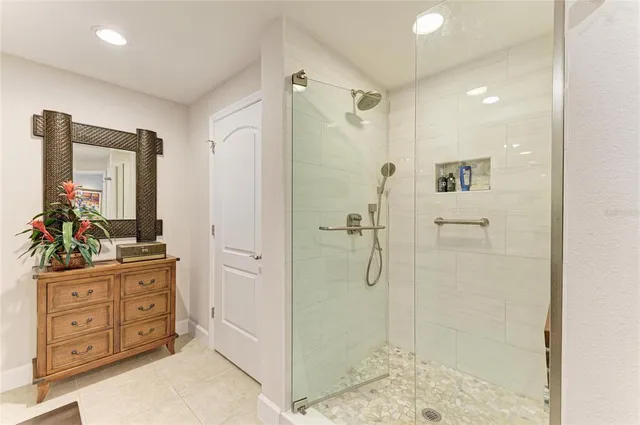 a balcony with furniture and a potted plant