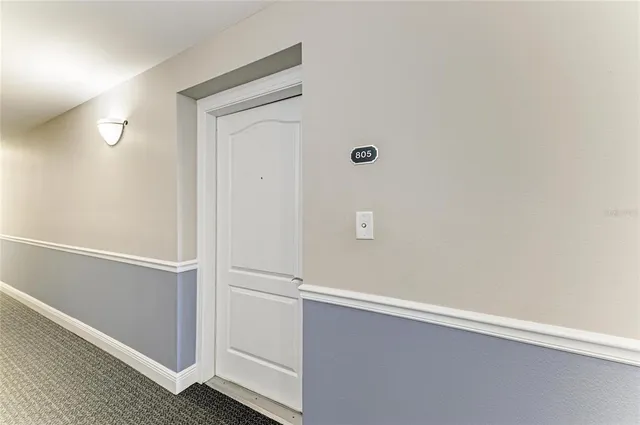 a kitchen with stainless steel appliances granite countertop a sink a stove and cabinets