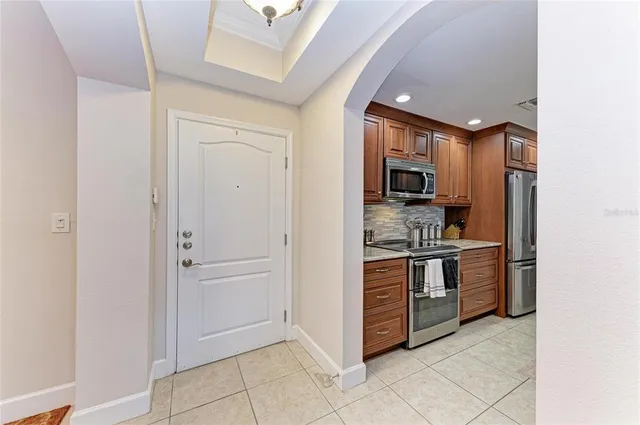a kitchen with granite countertop a sink and cabinets