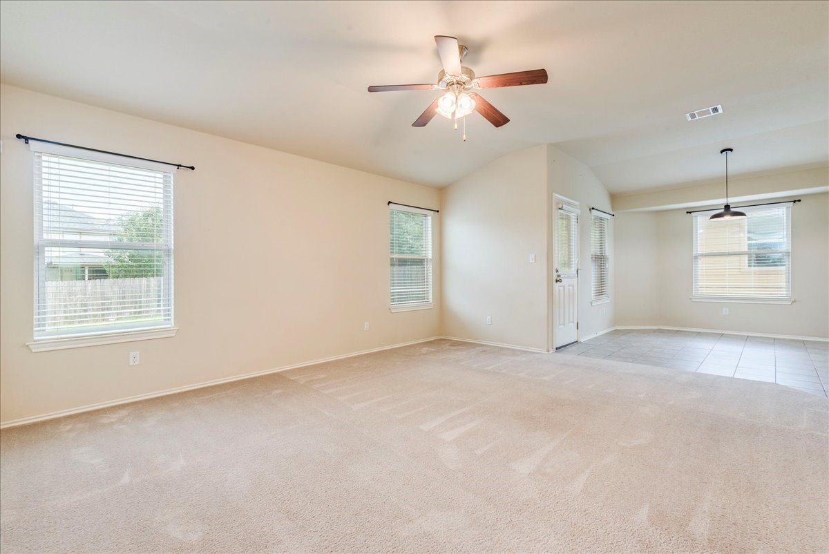 1061 Violet Lane Kyle, TX 78640 - Photo 4 of 34 Another angle view of the living room with abundance of natural light