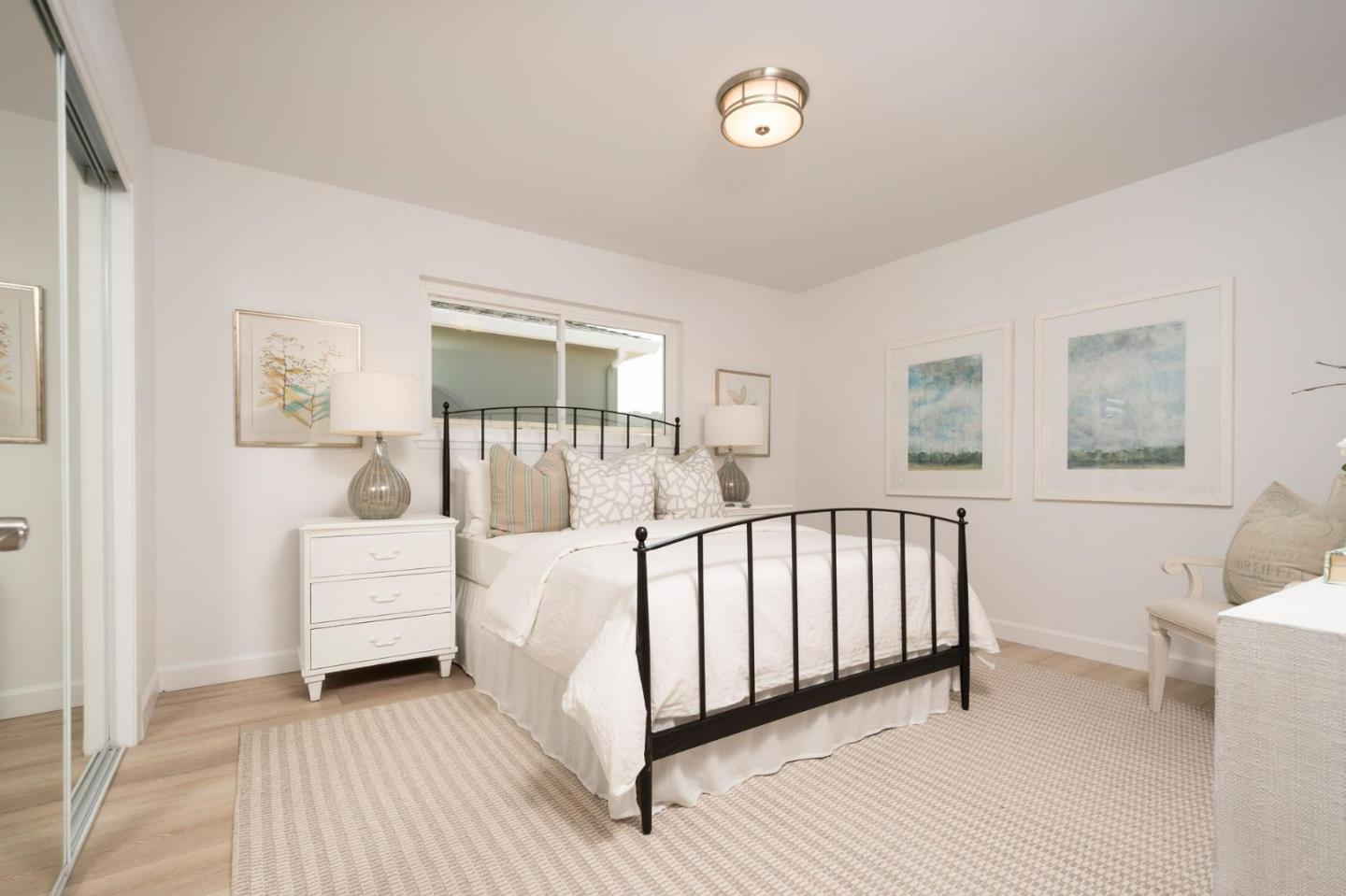 150 Surf Street Pacifica, CA 94044 - Photo 15 of 20 a view of a bedroom with furniture and windows