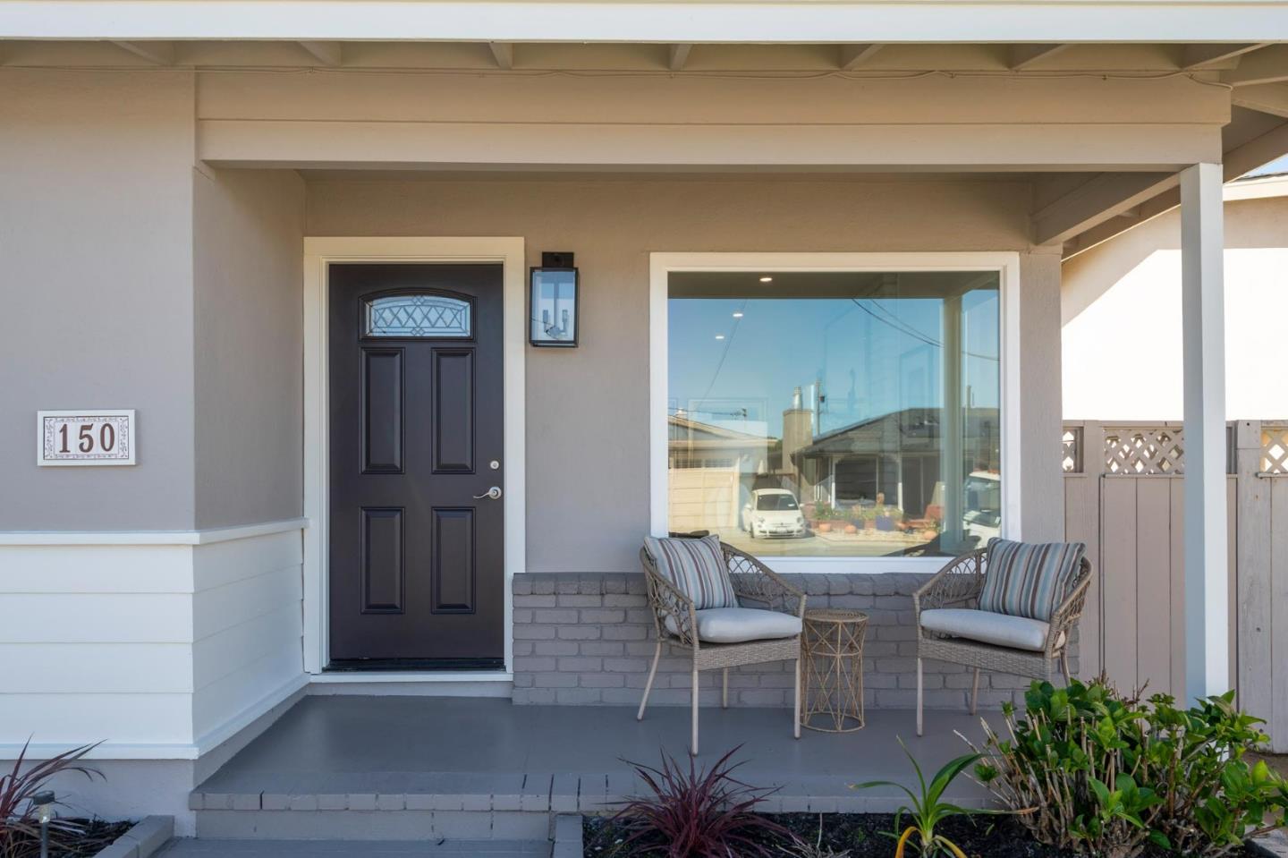 150 Surf Street Pacifica, CA 94044 - Photo 2 of 20 a living room with furniture and a potted plant