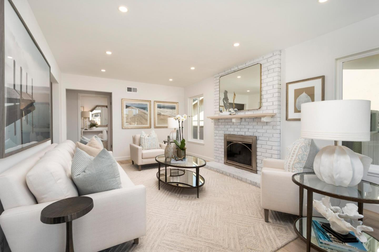 150 Surf Street Pacifica, CA 94044 - Photo 4 of 20 a living room with furniture and a fireplace