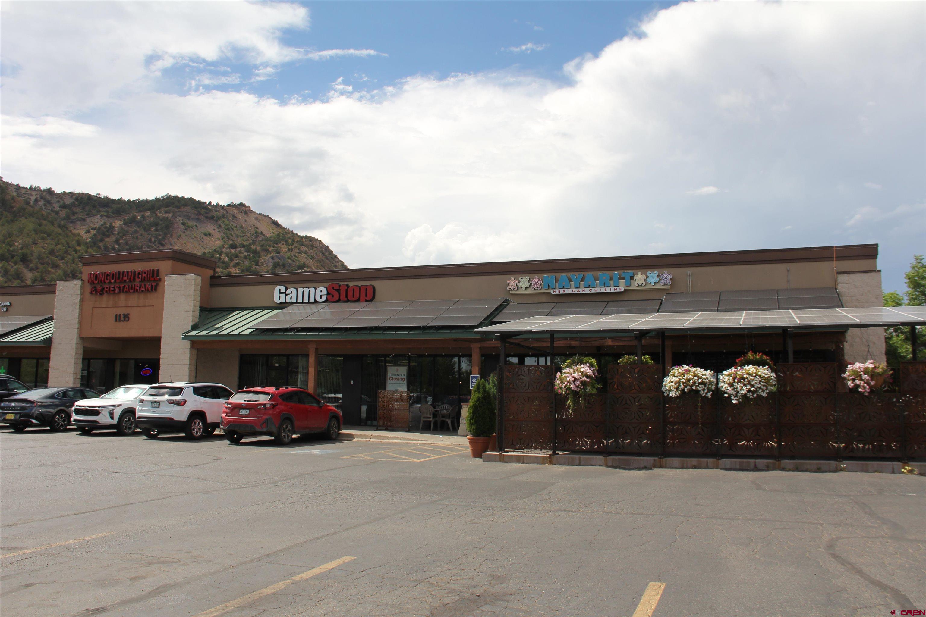 1135 South Camino Del Rio Durango, CO 81303 - Photo 4 of 4 a car parked in front of a building