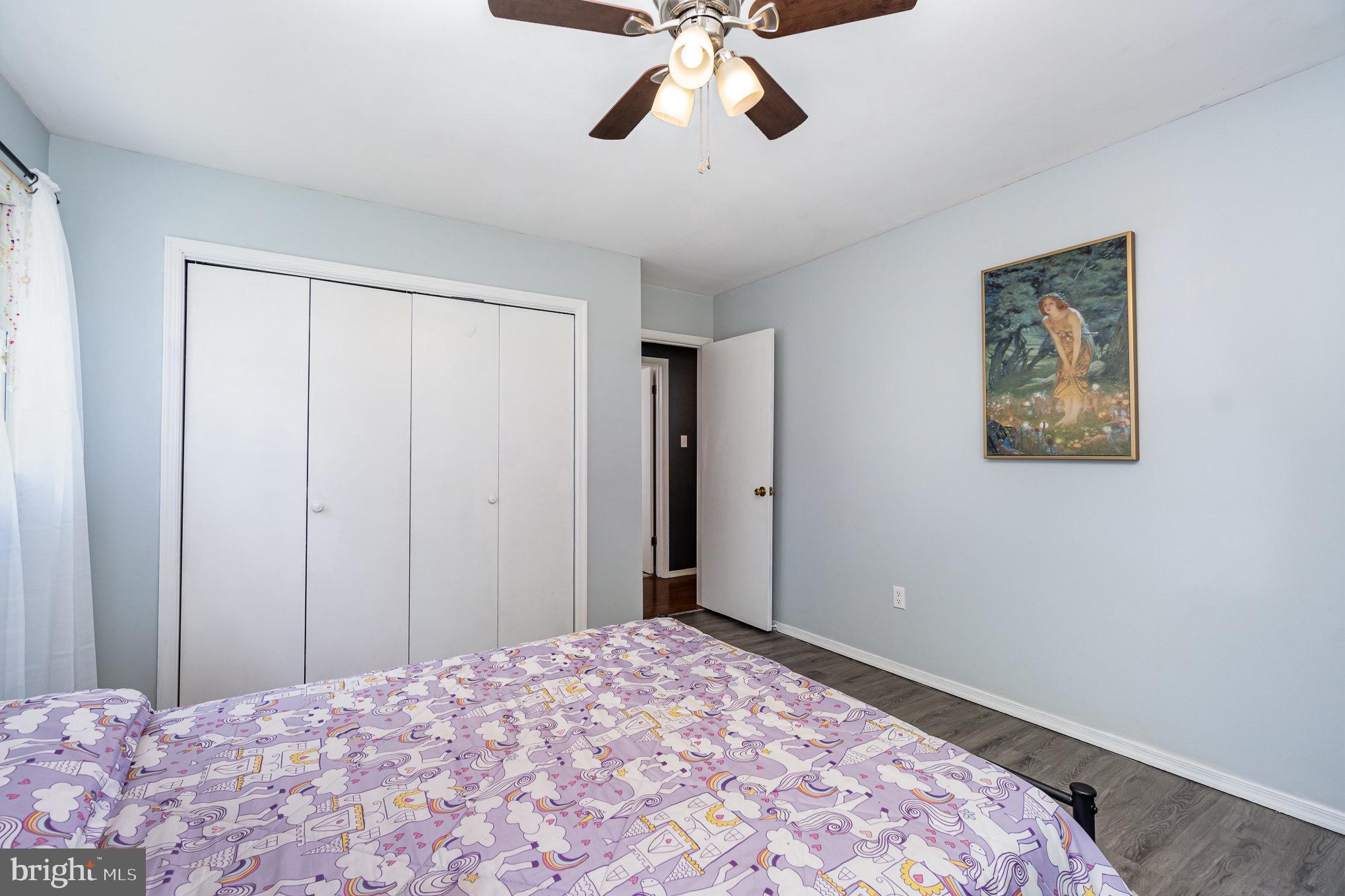 335 Apple Ridge Road Loysville, PA 17047 - Photo 19 of 46 a bedroom with a bed and a chandelier