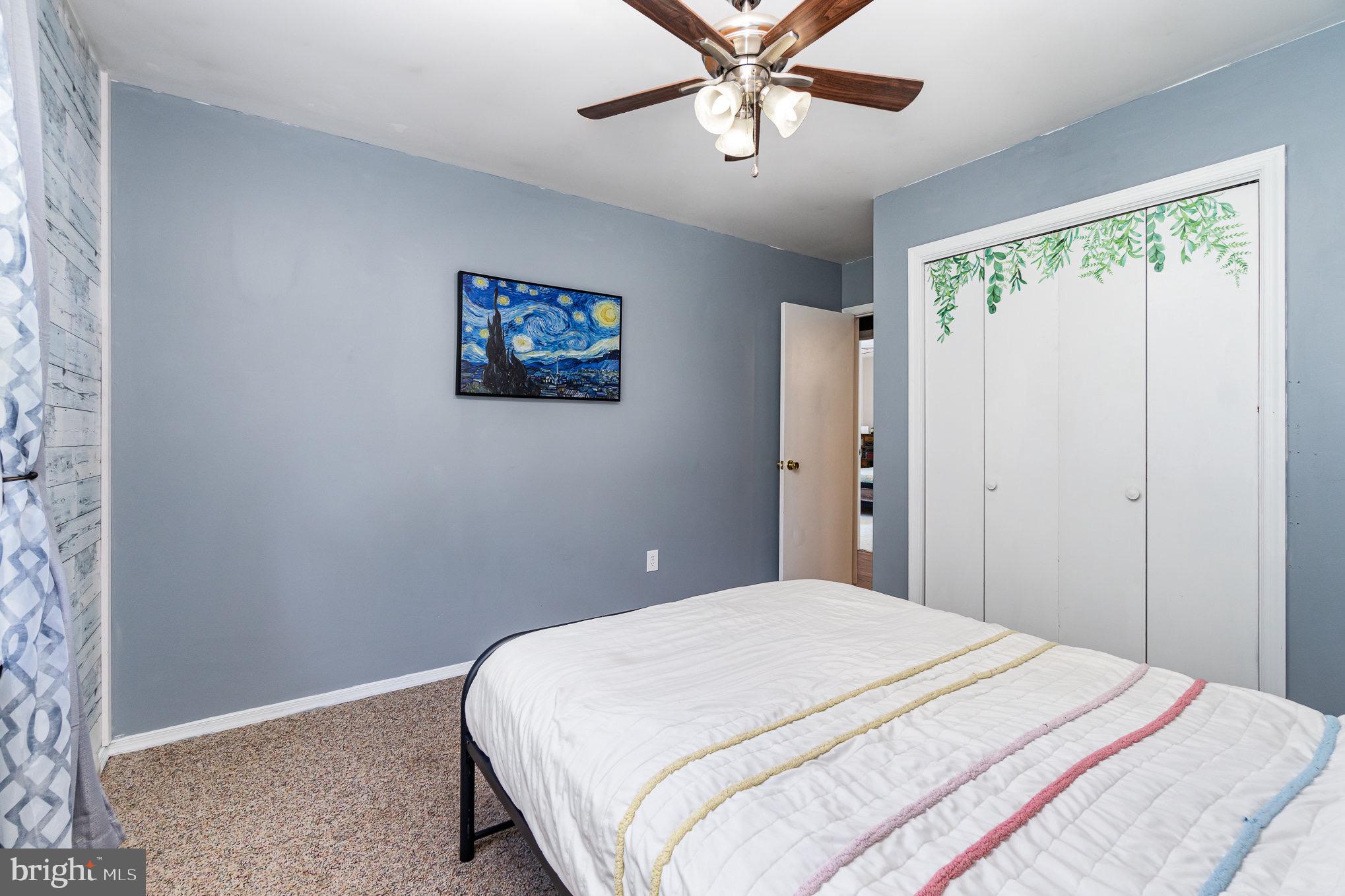 335 Apple Ridge Road Loysville, PA 17047 - Photo 21 of 46 a bedroom with a large bed and a chandelier