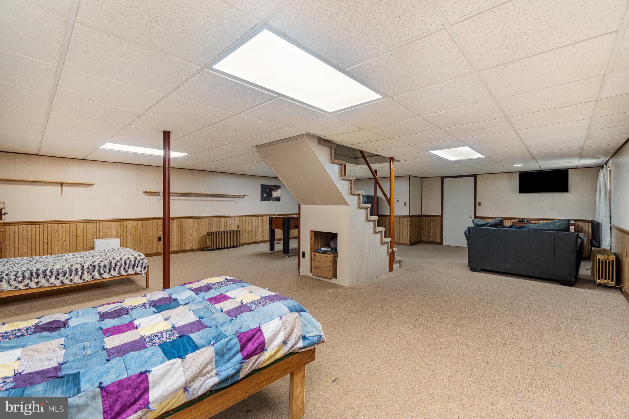 335 Apple Ridge Road Loysville, PA 17047 - Photo 27 of 46 a bedroom with furniture and a flat screen tv